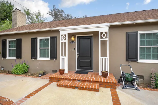 a aerial view of a house with a yard