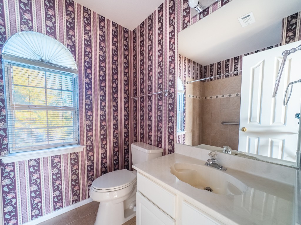 1706 Apache Trail Round Rock, TX 78665 - Photo 23 of 40 Full bath with wallpapered walls, tile patterned flooring, vanity, and a shower with shower curtain