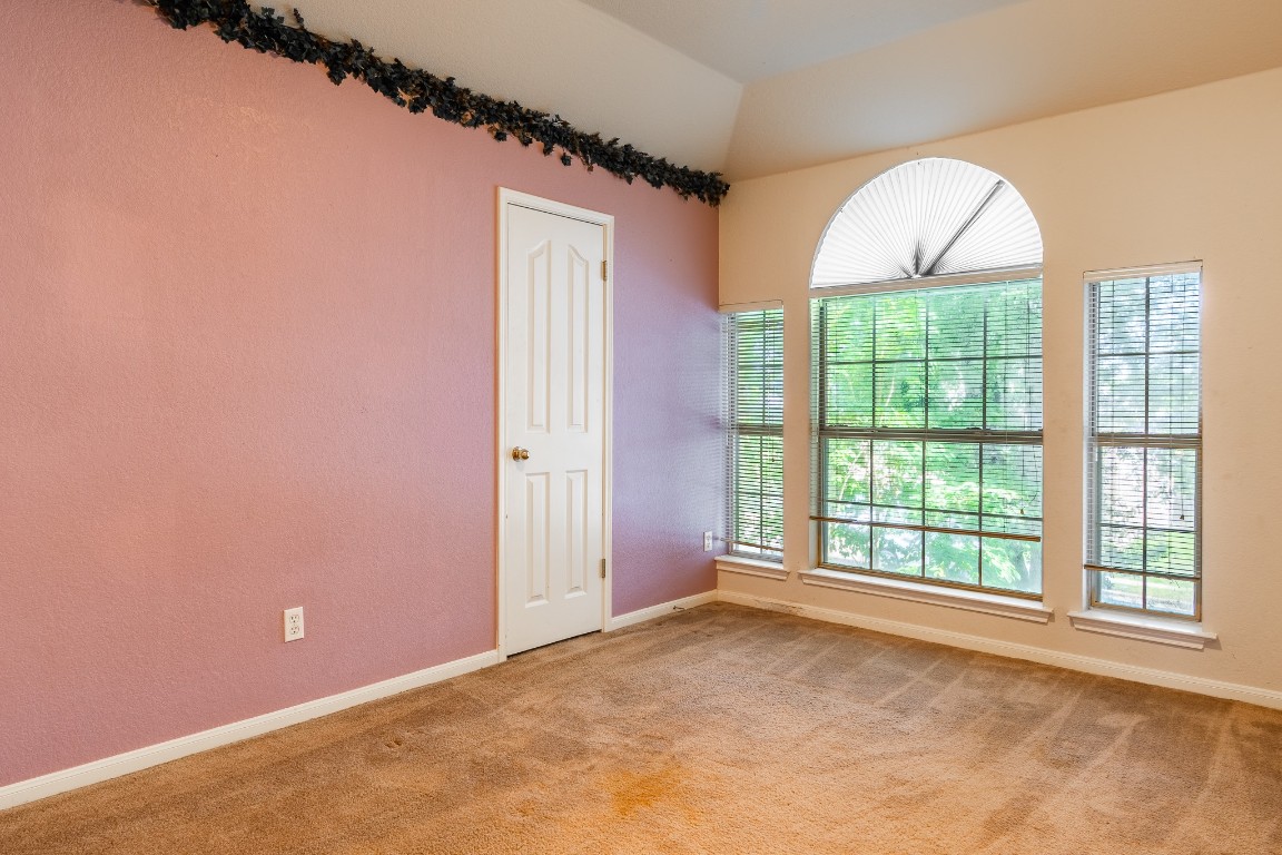 1706 Apache Trail Round Rock, TX 78665 - Photo 24 of 40 Empty room featuring light carpet and baseboards