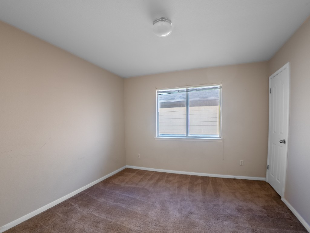 1706 Apache Trail Round Rock, TX 78665 - Photo 26 of 40 Carpeted spare room with baseboards