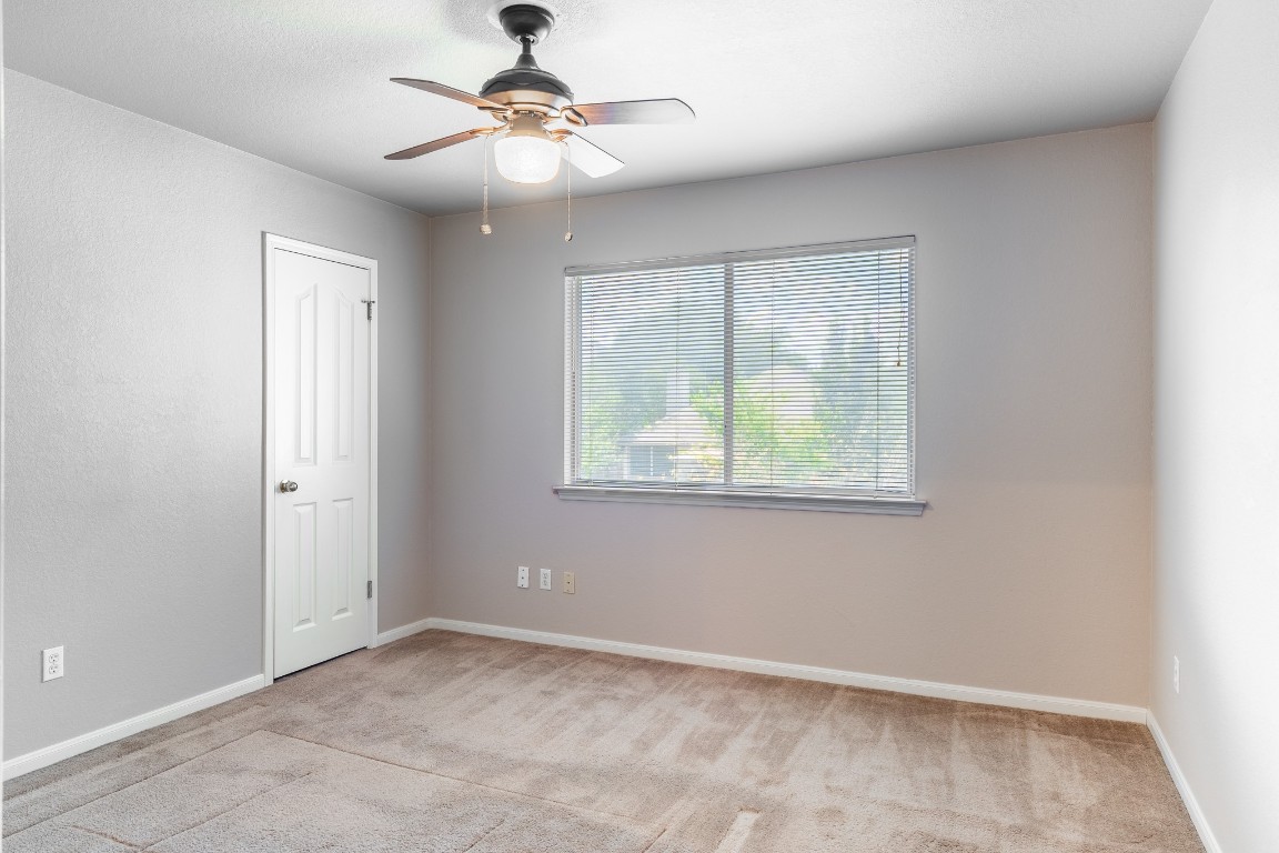 1706 Apache Trail Round Rock, TX 78665 - Photo 29 of 40 Unfurnished room featuring light carpet and ceiling fan
