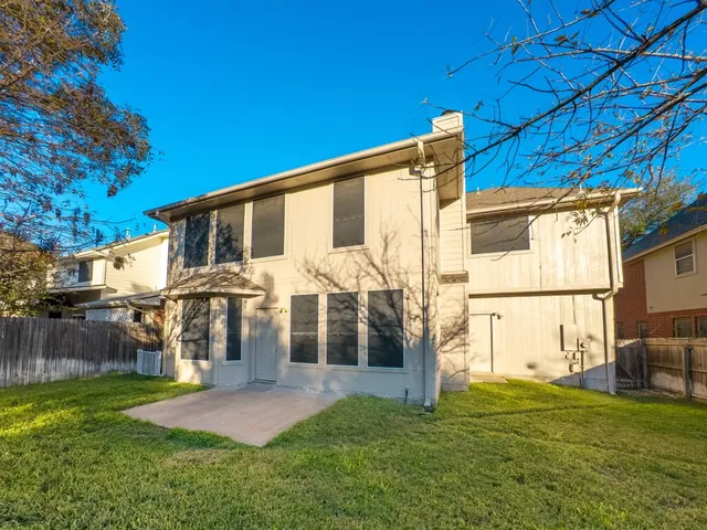 a view of a park with large trees