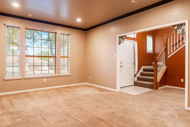 a view of an empty room with a window