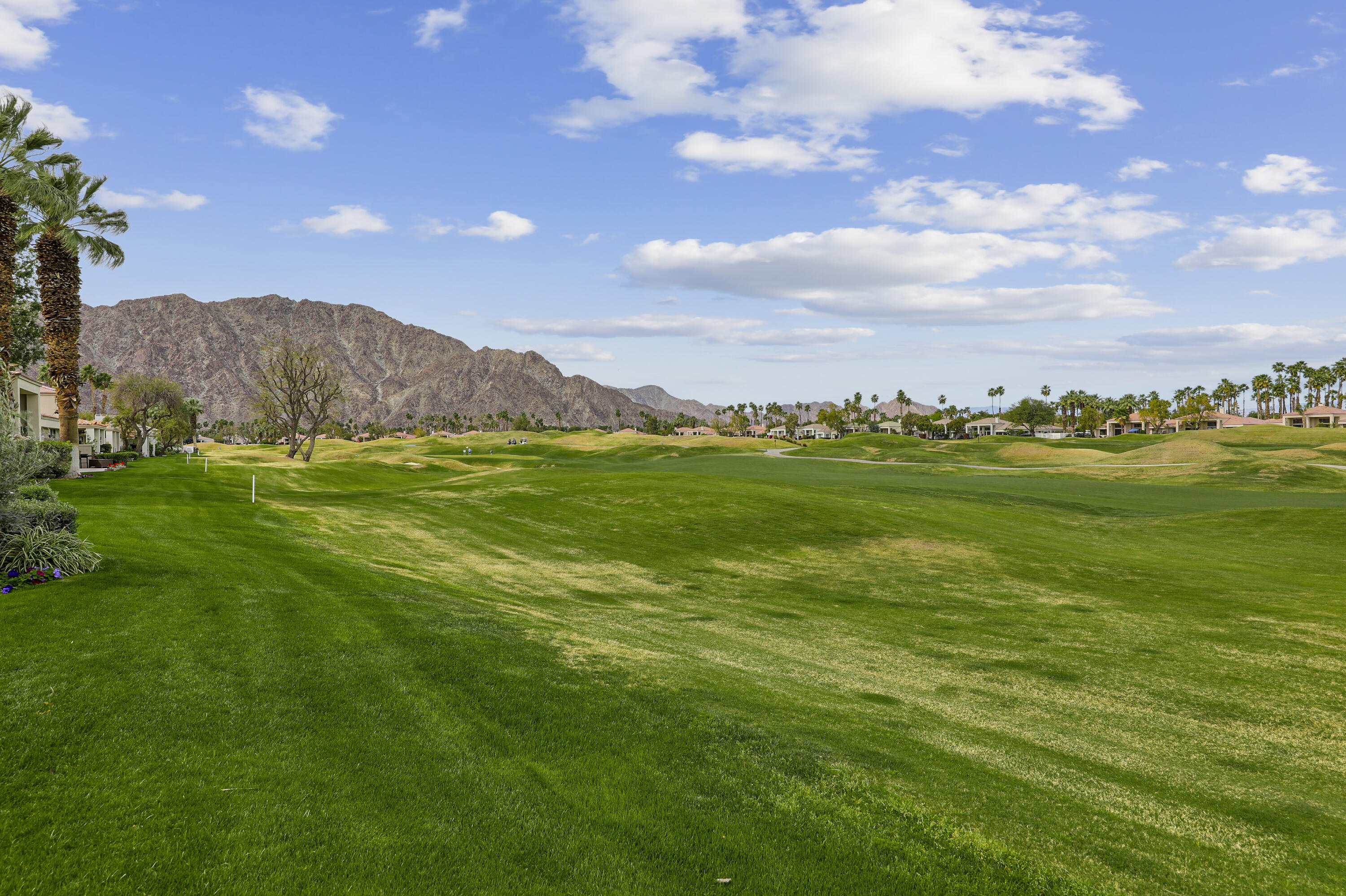 54721 Inverness Way La Quinta, CA 92253 - Photo 40 of 52 a view of an ocean and a yard