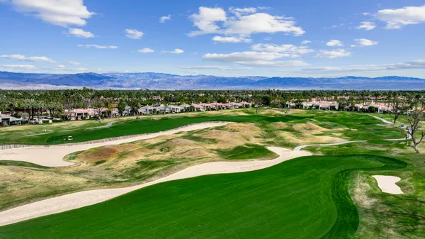a view of a golf course with a lake