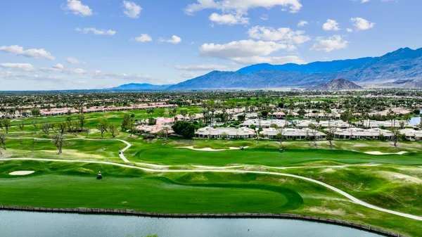 a view of a play ground in front of a house