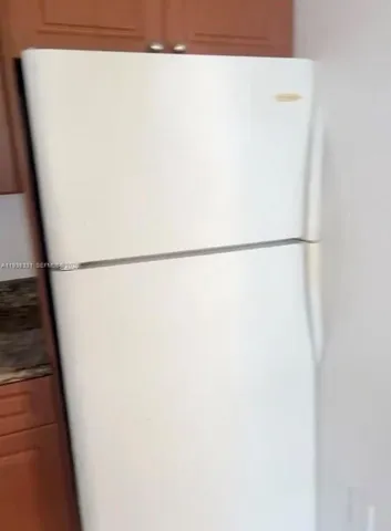 a close view of a refrigerator in kitchen