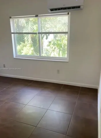 a view of a room that has a large window