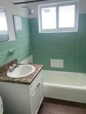 a bathroom with a sink and a bathtub