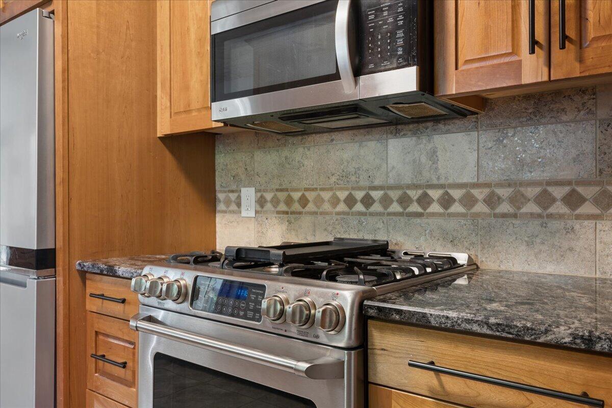431 Langdon Road Evington, VA 24550 - Photo 11 of 54 a kitchen with granite countertop cabinets stove top oven and microwave