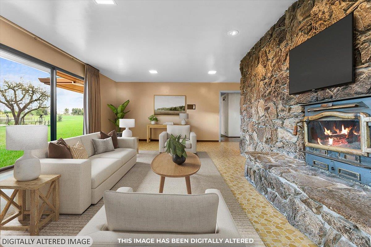 2062 Woolsey Road Fulton, CA 95439 - Photo 14 of 44 a living room with furniture a flat screen tv and a fireplace
