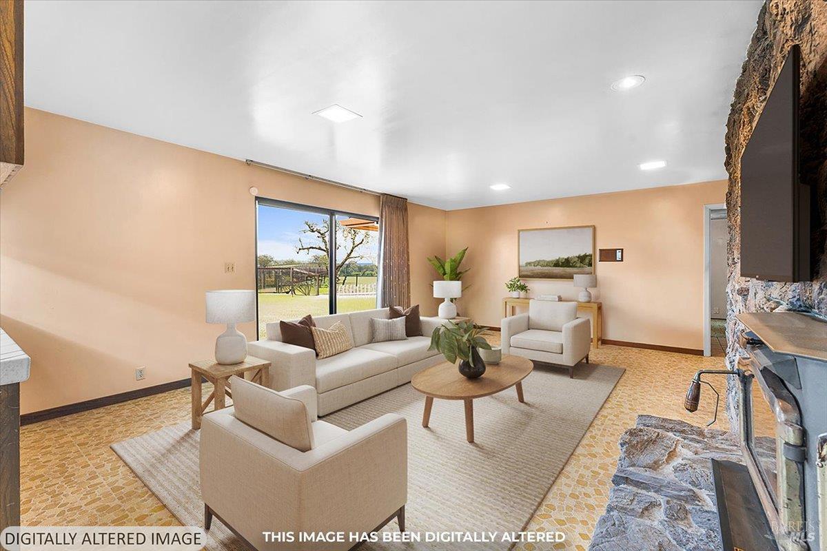 2062 Woolsey Road Fulton, CA 95439 - Photo 16 of 44 a living room with furniture large window and a flat screen tv