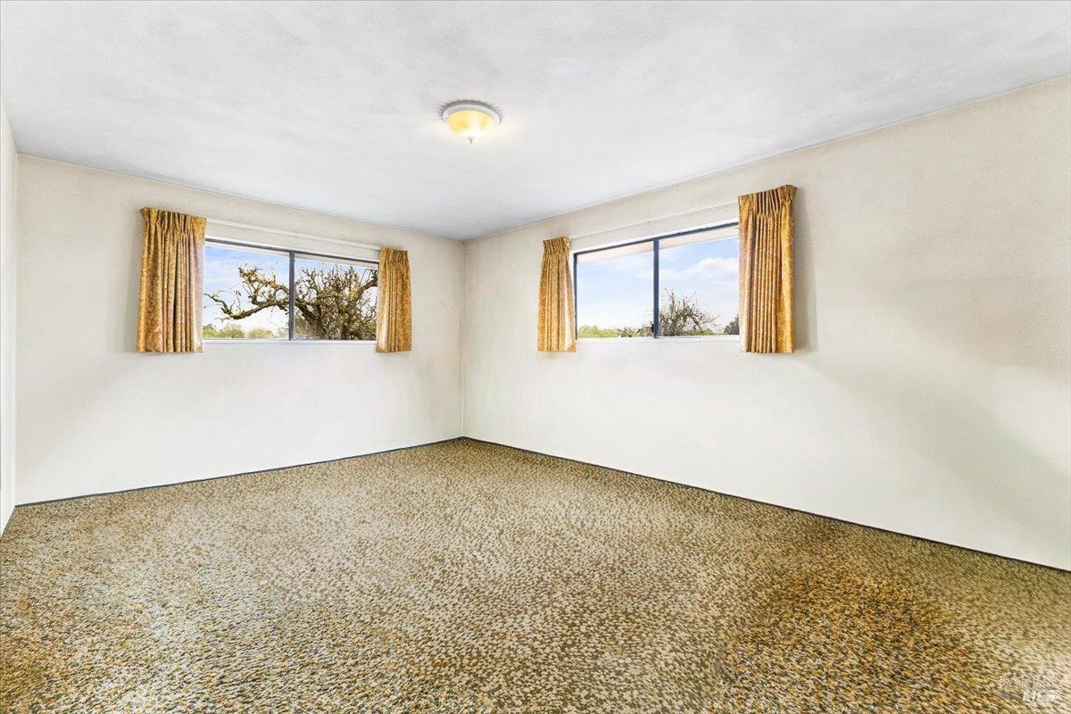 2062 Woolsey Road Fulton, CA 95439 - Photo 19 of 44 wooden floor in an empty room with a window