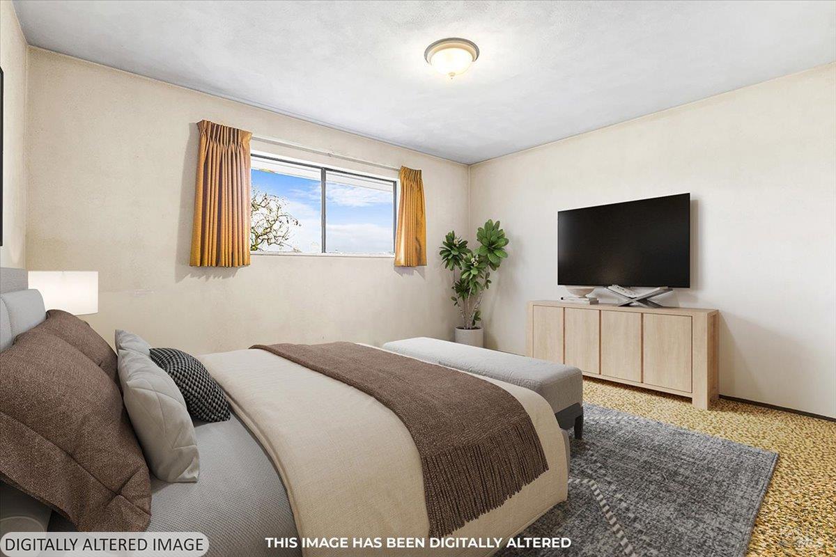 2062 Woolsey Road Fulton, CA 95439 - Photo 25 of 44 a bedroom with a flat screen television and a bed