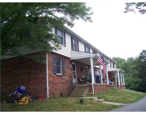 1131 Harmony Road Baden, PA 15005 - Photo 1 of 3 Exterior Front. FABULOUS INVESTMENT OPPORTUNITY IN BADEN! This is a four unit property. Each unit features central air, full basements with laundry hook-ups, living room, dining room, kitchen, one and half baths, and a deck or patio. Unit A has a fireplace.