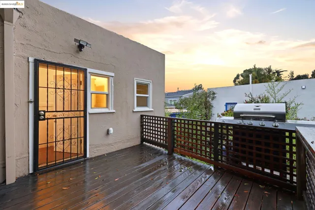 a view of a house with lots of trees and plants