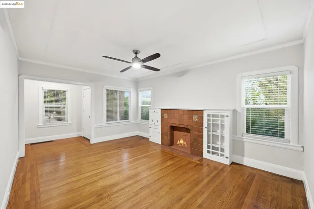 a kitchen with a sink a microwave a refrigerator and cabinets