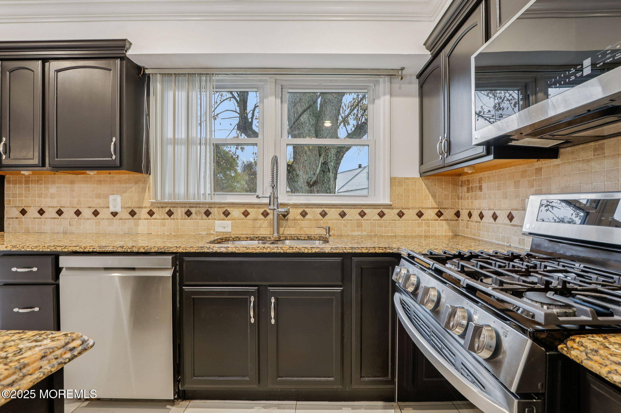 1100 Green Grove Road Neptune Township, NJ 07753 - Photo 12 of 52 a kitchen with granite countertop a stove and a sink