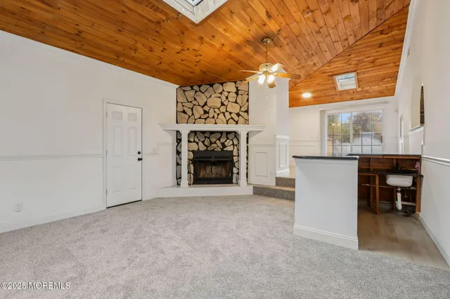 a view of a livingroom with furniture and a fireplace