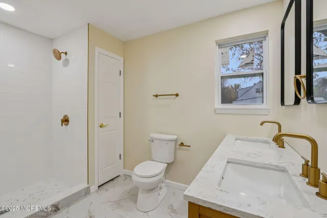 a bathroom with a toilet and a sink