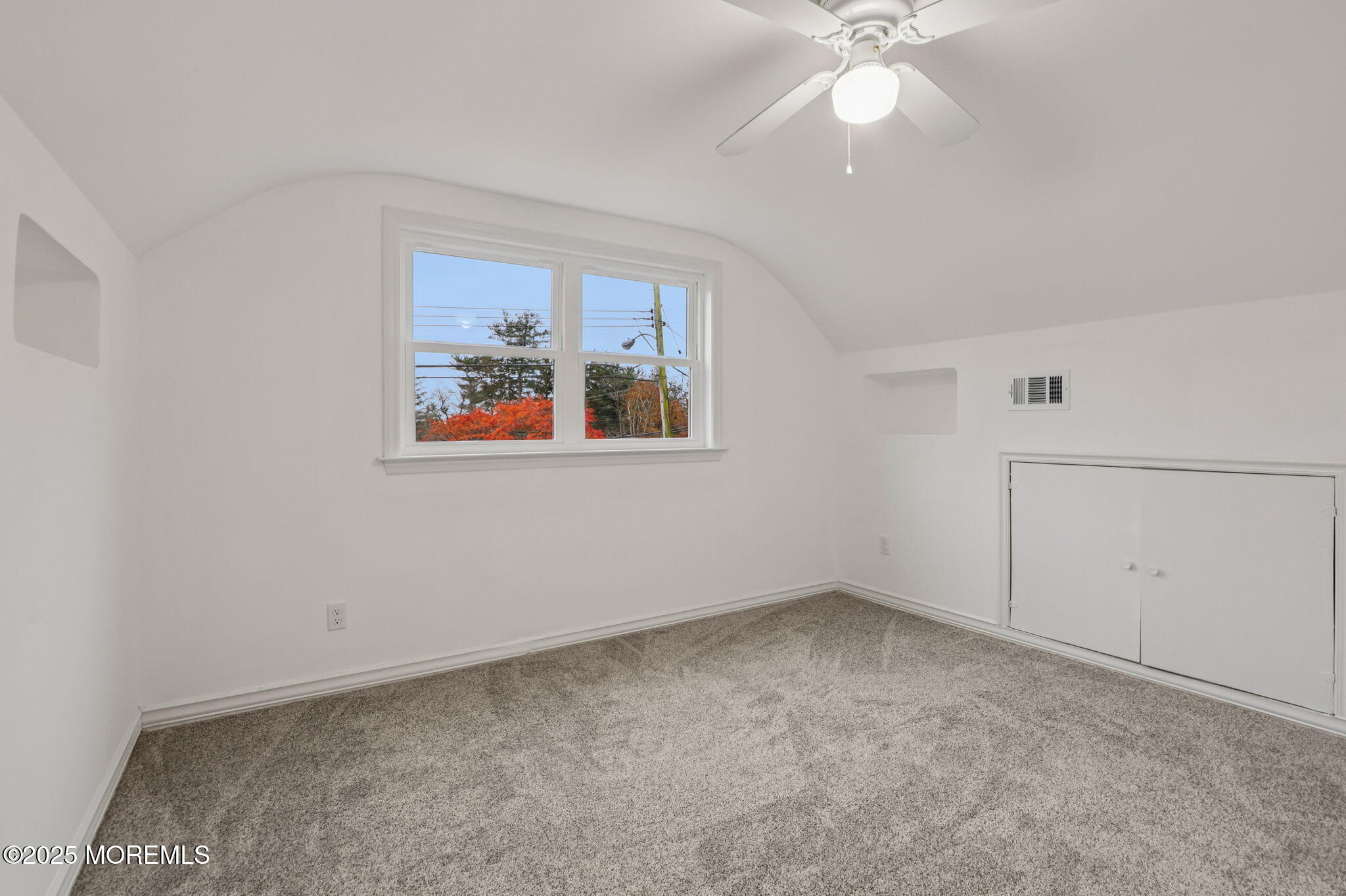 1100 Green Grove Road Neptune Township, NJ 07753 - Photo 26 of 52 a view of an empty room with window and chandelier fan