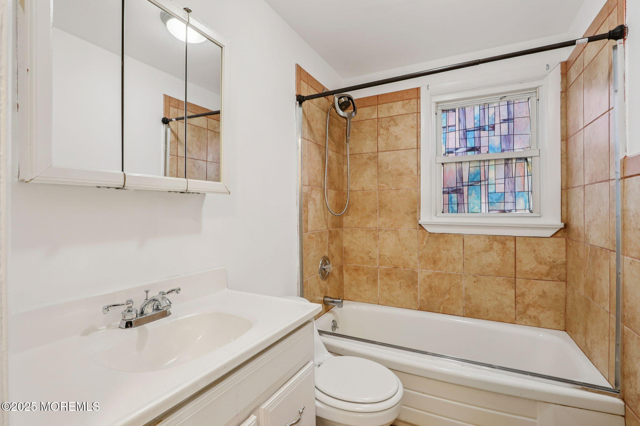 1100 Green Grove Road Neptune Township, NJ 07753 - Photo 27 of 52 a bathroom with a sink a toilet and a bathtub