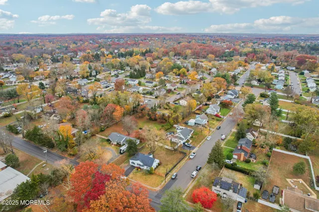 an aerial view of residential building with green space
