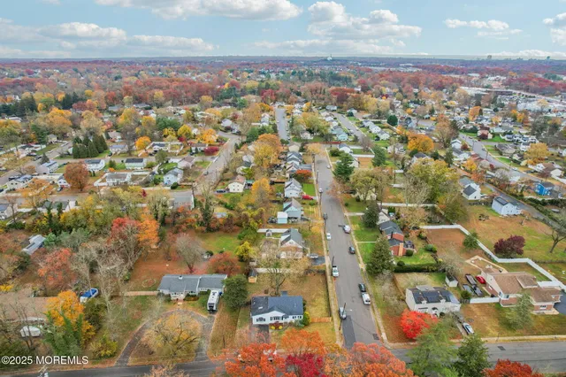 an aerial view of residential building with green space