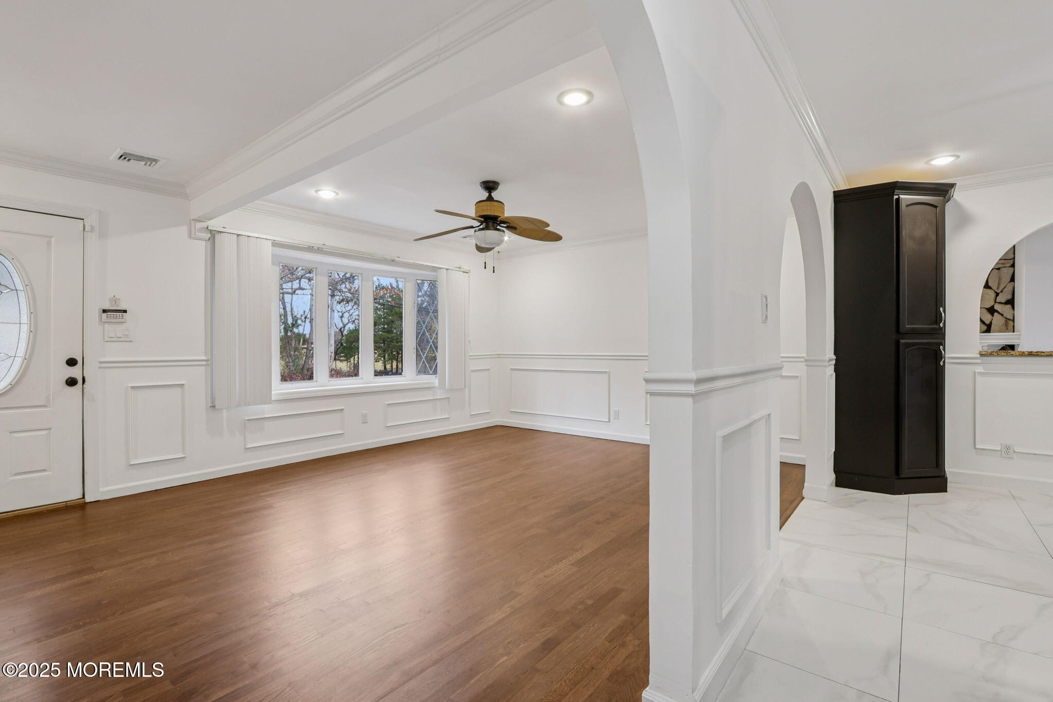 1100 Green Grove Road Neptune Township, NJ 07753 - Photo 7 of 52 a view of empty room with wooden floor and fan