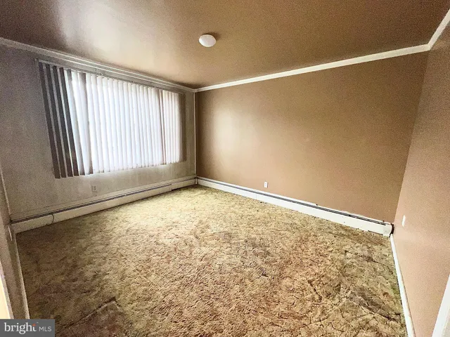 a view of a hallway with a chandelier