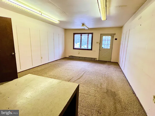 a bathroom with a tub a sink and a shower