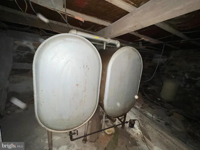 a spacious bedroom with a bed and window