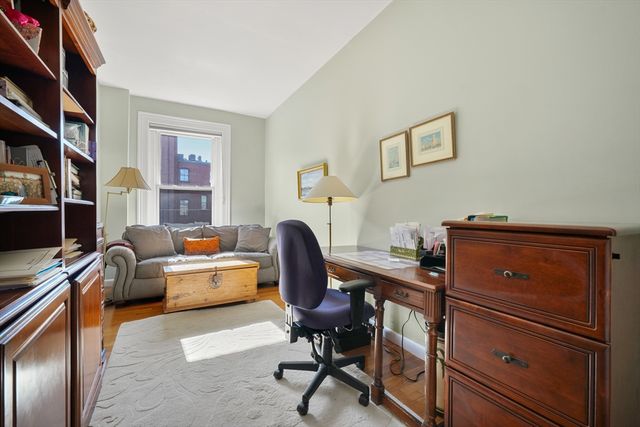 a view of a workspace with furniture and a workspace