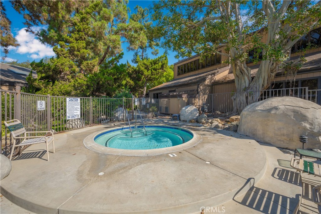 7890 East Spring Street, Unit 2L Long Beach, CA 90815 - Photo 46 of 47 a backyard of a house with yard and outdoor seating