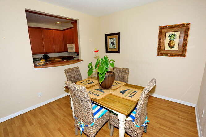 4159 Main Street Jupiter, FL 33458 - Photo 15 of 39 a view of a dining room with furniture and wooden floor
