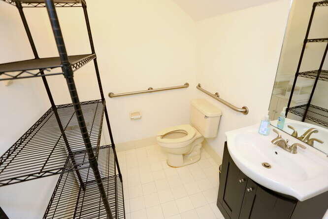 4159 Main Street Jupiter, FL 33458 - Photo 28 of 39 a bathroom with a sink and a mirror