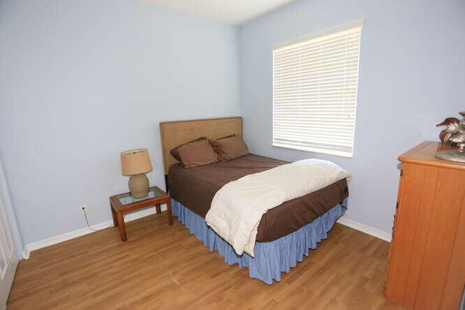 4159 Main Street Jupiter, FL 33458 - Photo 32 of 39 a bedroom with a bed and a window