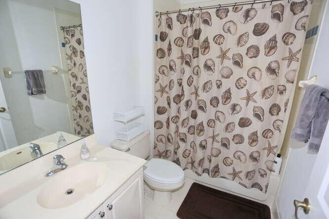 4159 Main Street Jupiter, FL 33458 - Photo 33 of 39 a bathroom with a sink and a toilet