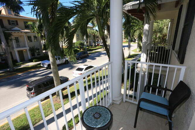 4159 Main Street Jupiter, FL 33458 - Photo 35 of 39 a view of an chairs and tables in the balcony