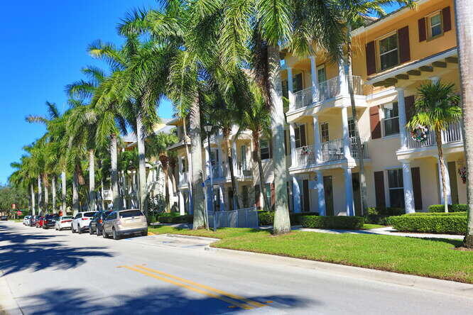 4159 Main Street Jupiter, FL 33458 - Photo 5 of 39 a view of a street with a building and trees in the background
