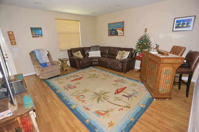 4159 Main Street Jupiter, FL 33458 - Photo 6 of 39 a living room with furniture and a wooden floor