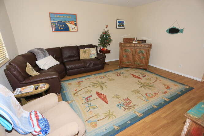 4159 Main Street Jupiter, FL 33458 - Photo 8 of 39 a living room with furniture and wooden floor