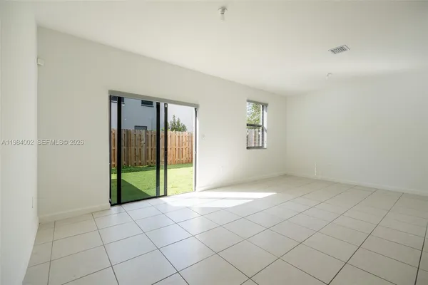 a view of an empty room and window