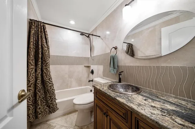 a kitchen with sink and large window