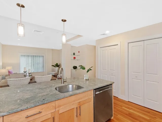 a kitchen with a sink and a refrigerator