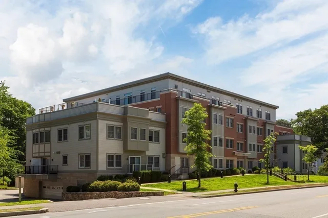 a view of a building with a yard