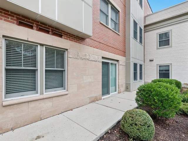 a view of a house with a small yard