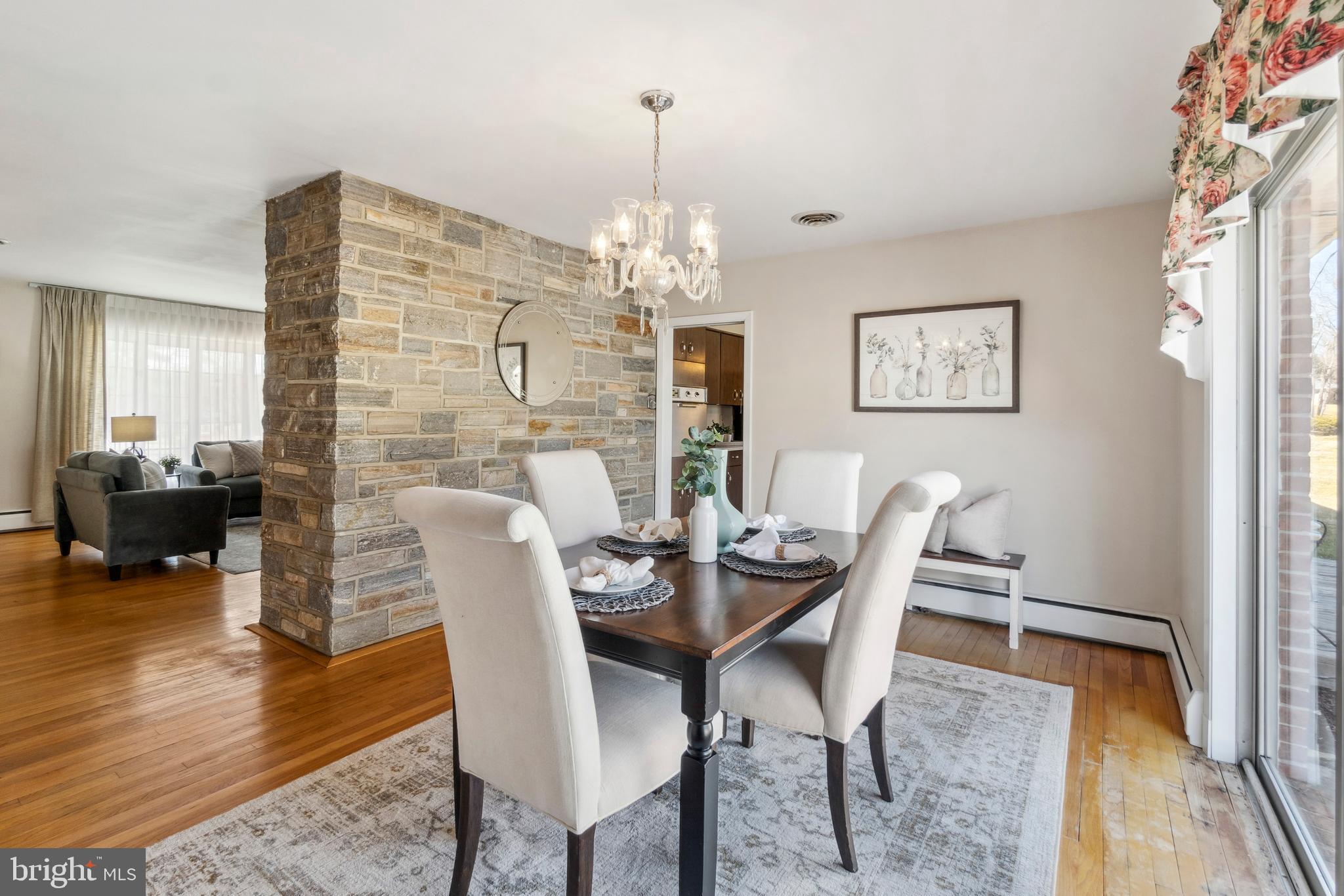 4001 Crescent Road Ellicott City, MD 21042 - Photo 14 of 41 a view of a dining room with furniture wooden floor and a chandelier
