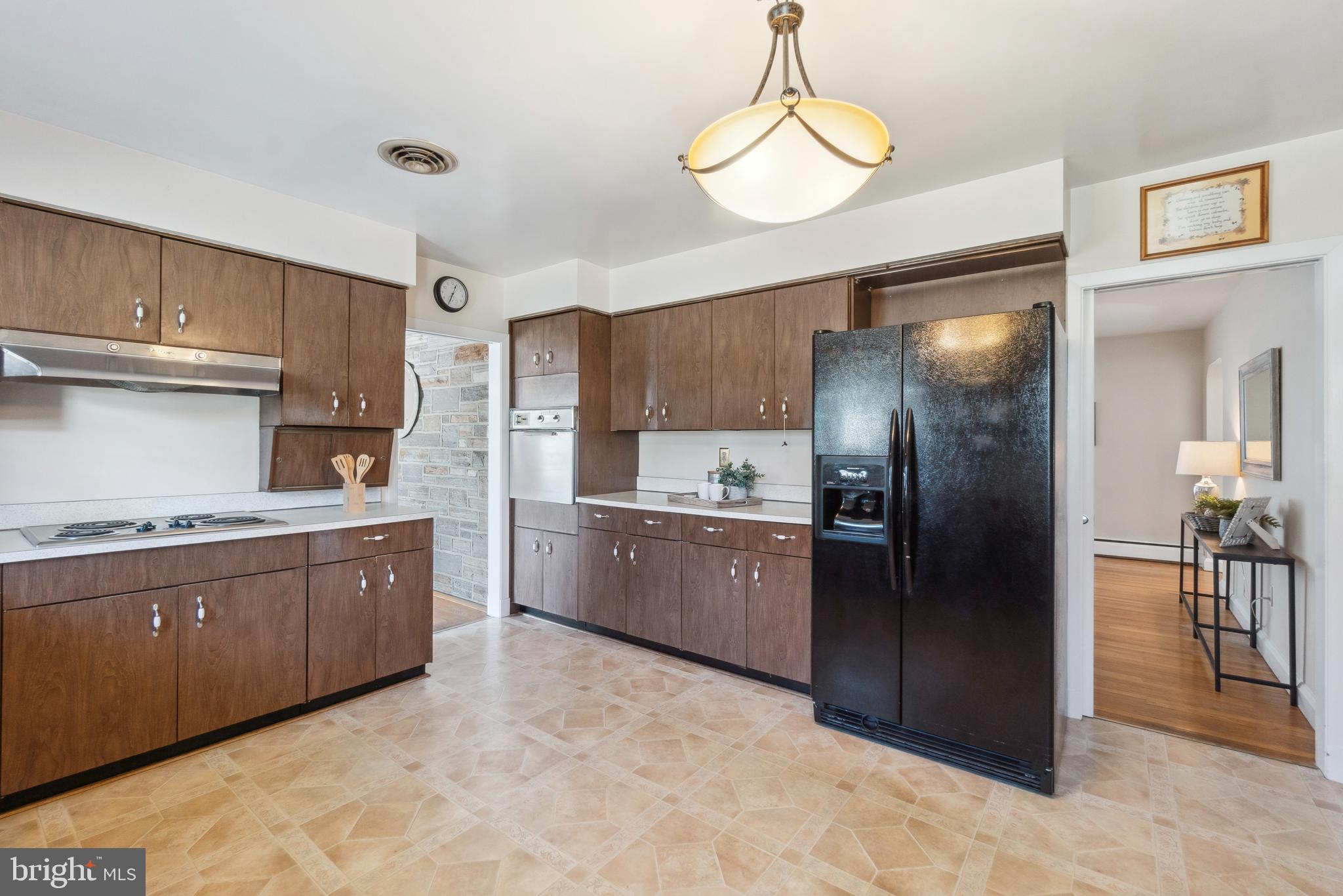 4001 Crescent Road Ellicott City, MD 21042 - Photo 19 of 41 a large kitchen with cabinets and stainless steel appliances