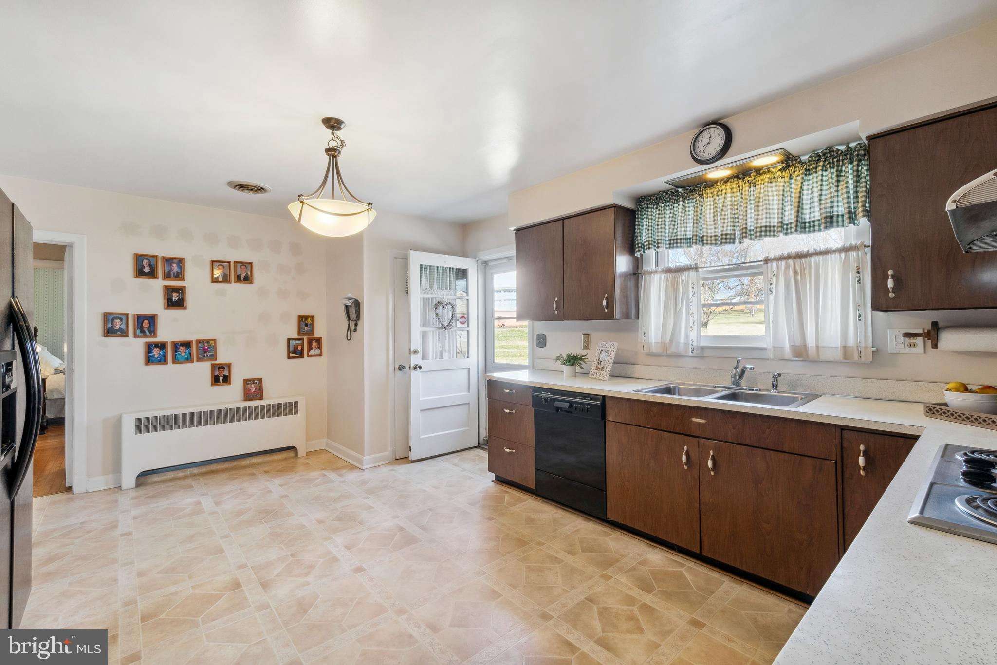 4001 Crescent Road Ellicott City, MD 21042 - Photo 20 of 41 a large kitchen with kitchen island a sink stainless steel appliances and cabinets